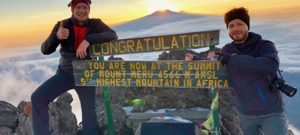 Hikers-at-the-Mount-Meru-Summit-Easy-Travel-Tanzania-scaled-1